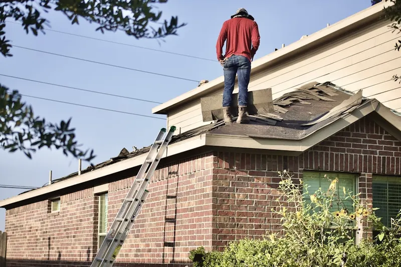 Professional roofer working on a residential roof in Orinda